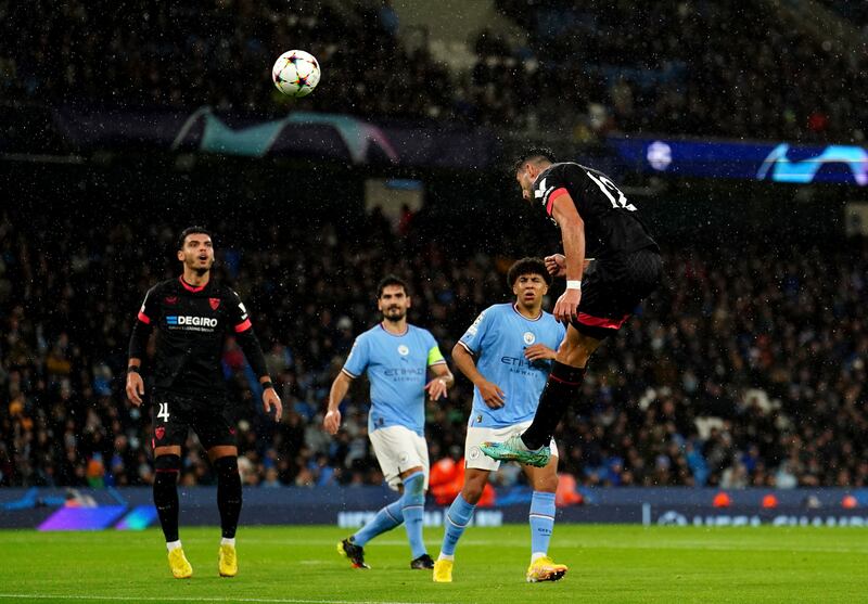 Rafa Mir heads Sevilla in front. PA