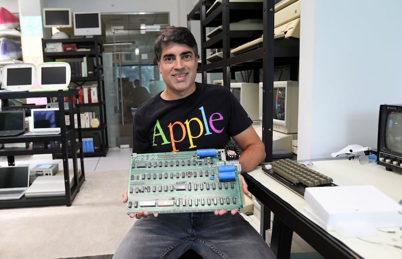 Mr Grewal holds the motherboard of an Apple Computer 1, hand-built by Apple co-founders Steve Jobs and Steve Wozniak.