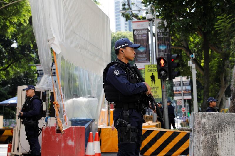 Police stand guards outside St Regis hotel in Singapore. Tyrone Siu / Reuters