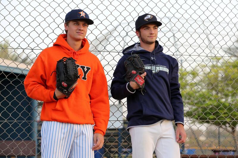 Dubai, United Arab Emirates - Reporter: Paul Radley. Sport. Baseball. Dubai Senior Baseball players (final year of school) have received offers to play baseball next season at university level in US and Canada. Ollie Duthie (blue) and Mattia Sparacino. Wednesday, March 24th, 2021. Dubai. Chris Whiteoak / The National