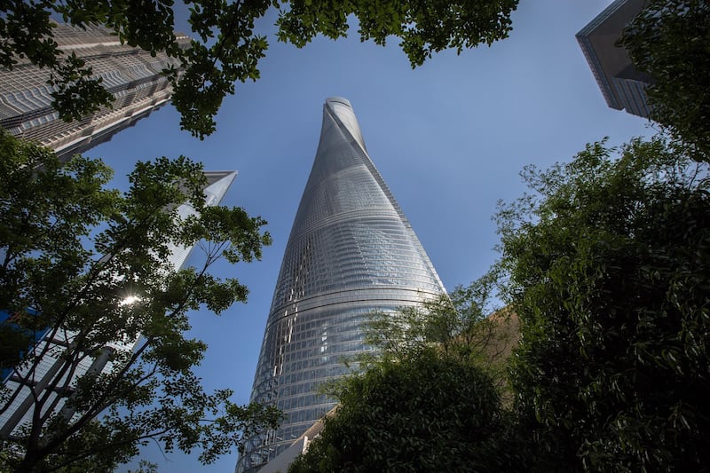 The Shanghai Tower exterior resembles a snake as it spirals upwards in the Pudong area of the city it was named after in China. At 632 metres tall, it has 128 floors and is the country's tallest building and the world's number two. Roman Pilipey / EPA