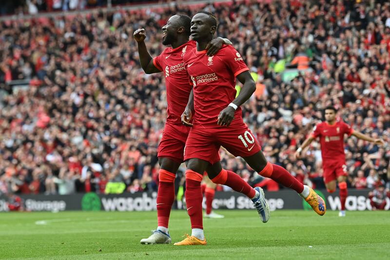 Sadio Mane celebrates with Naby Keita after scoring a goal that was later cancelled due to an offside position. AFP