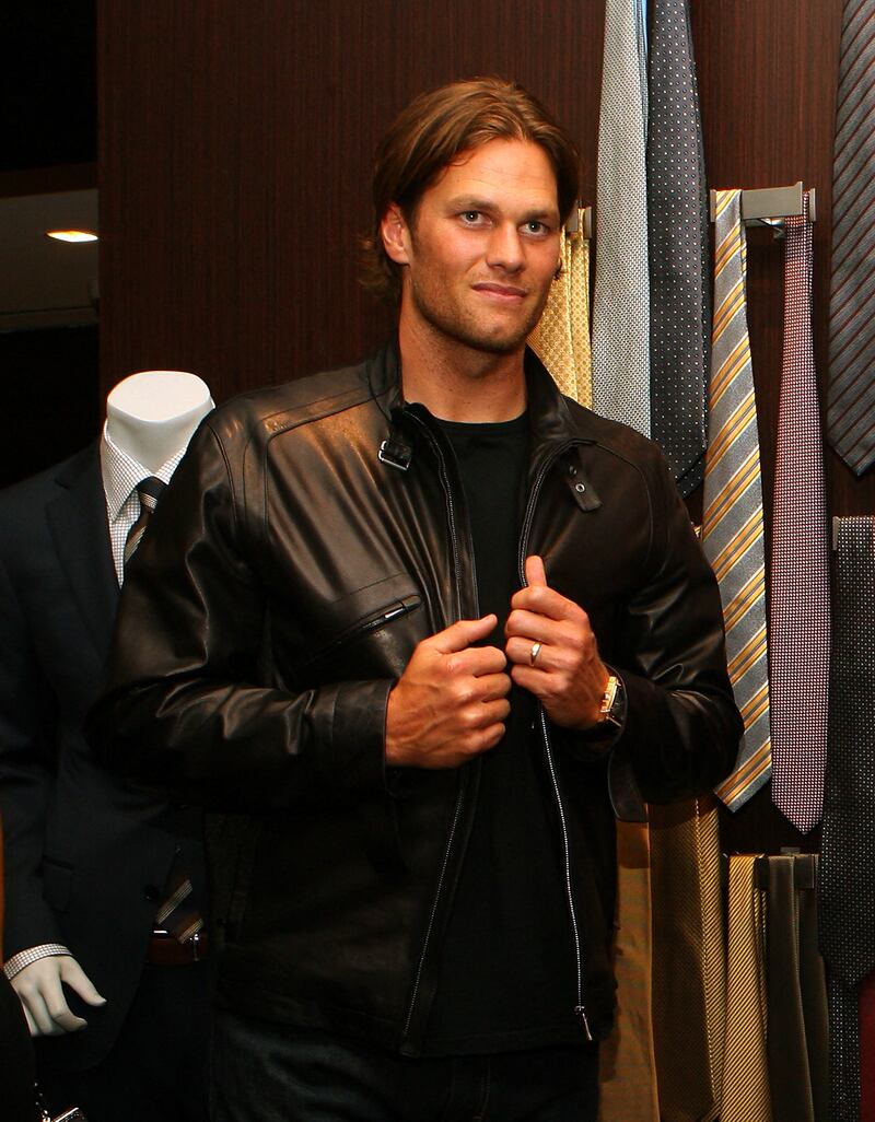 Brady sports a Zegna leather jacket at the brand's store opening on September 20, 2011, in Boston, Massachusetts. Getty