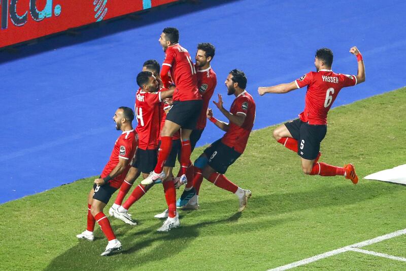 Ahly's players celebrate their opening goal during the CAF Champions League Final football match between Egyptian sides Zamalek and Al-Ahly at the Cairo International Stadium in Egypt's capital on November 27, 2020. (Photo by Khaled DESOUKI / AFP)