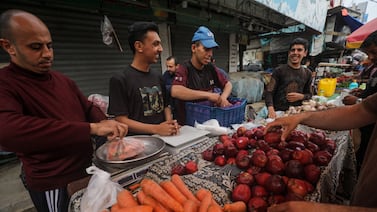 Palestinians sells fruits and vegetables at a market on the last Friday of Ramadan in Al Nusairat refugee camp, Gaza Strip. EPA