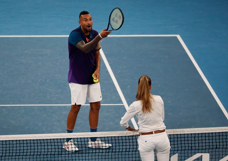 Nick Kyrgios speaks with umpire Marijana Veljovic after complaining about the net call. Reuters