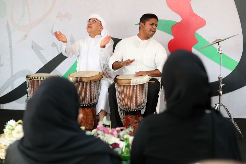 Participants play the drums