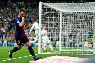 Barcelona midfielder Ivan Rakitic, left, celebrates scoring the only goal of the game against Real Madrid. AP Photo