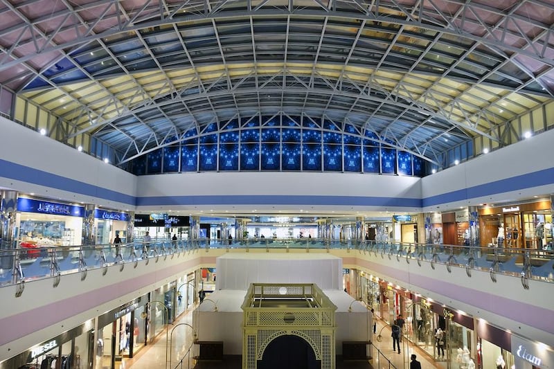 The mall has a canopied canvas roof at its centre that allows natural light to flood in, and that evokes a big top, with a central tower rising 128 metres into the sky. Delores Johnson / The National