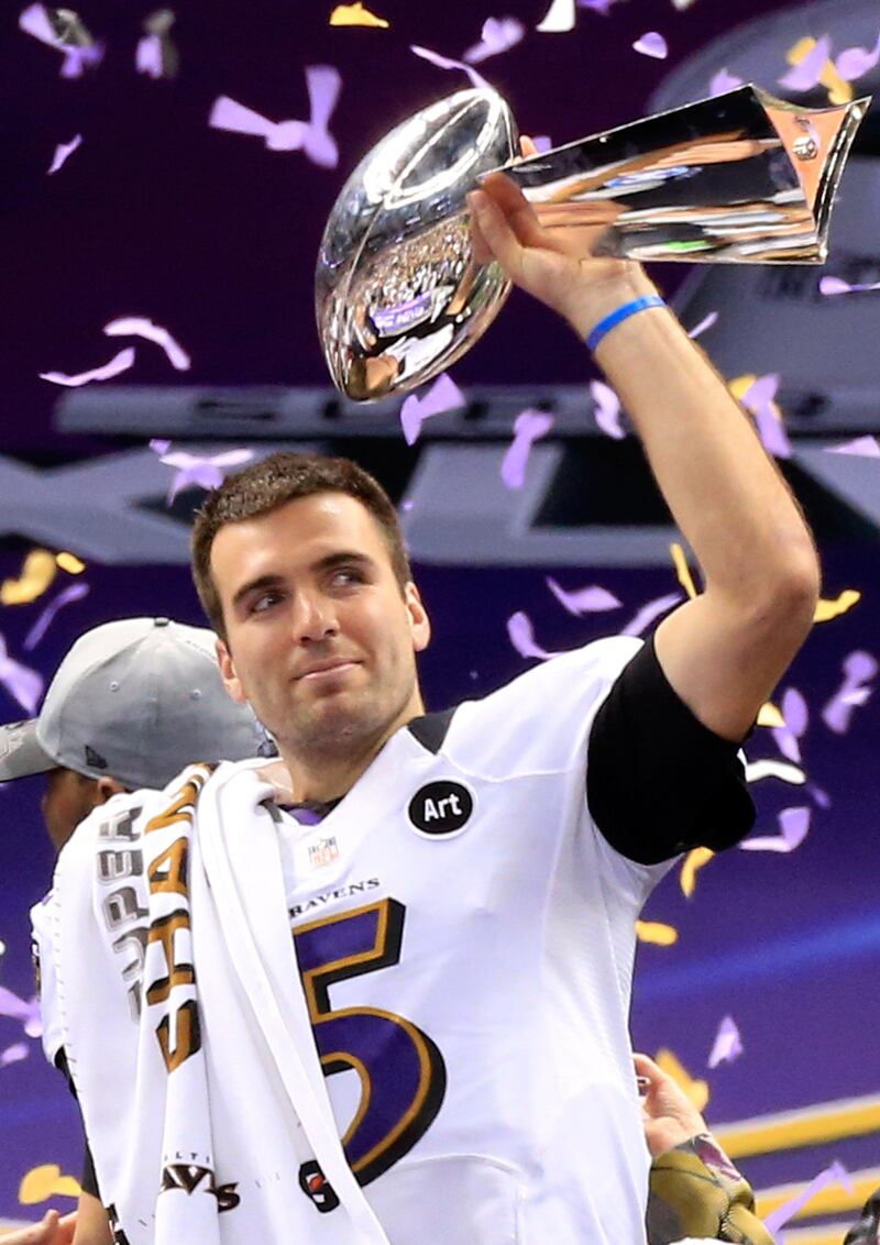 Joe Flacco #5 of the Baltimore Ravens holds up the Vince Lombardi Trophy following their 34-31 win against the Baltimore Ravens during Super Bowl XLVII at the Mercedes-Benz Superdome on February 3, 2013 in New Orleans, Louisiana.   Jamie Squire/Getty Images/AFP== FOR NEWSPAPERS, INTERNET, TELCOS & TELEVISION USE ONLY ==
 *** Local Caption ***  407943-01-09.jpg