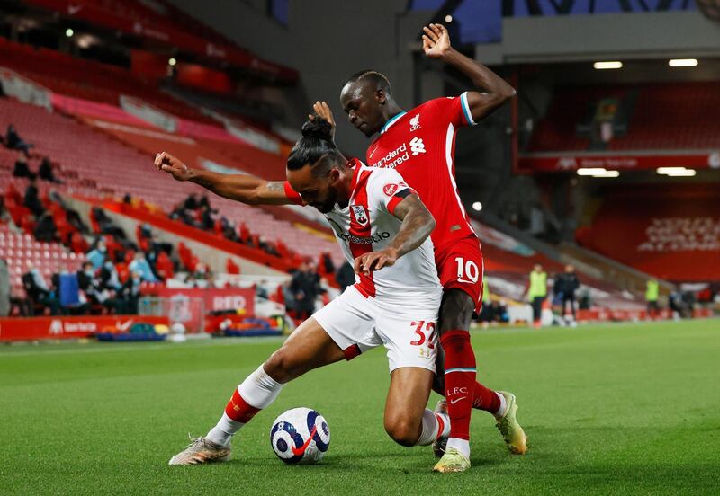 Southampton's Theo Walcott and Sadio Mane battle for possession. Reuters