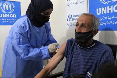 Syrian refugees receive free Jordanian government Covid-19 vaccines at Zaatari refugee camp, February 16, 2021. Getty Images
