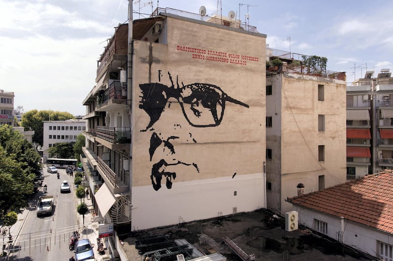 A giant mural depicts Italian composer Ennio Morricone created by Asterios Laskaris, Christos Laskaris and Dimitra Kalogirou under the auspices of the Greek Cultural Association Friends of Ennio Morricone's Music, in Larissa, Greece, July 24, 2018. Picture taken July 24, 2018.  REUTERS/Giannis Floulis