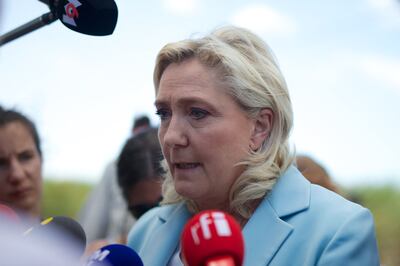 French far-right party RN presidential candidate Marine Le Pen answers journalists' questions on a campaign trip. AFP.
