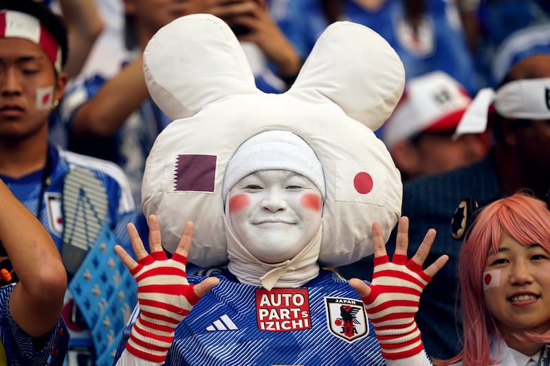 A Japan fan in buoyant mood ahead of the World Cup Qatar 2022 Group E match at the Khalifa International Stadium, Doha. PA