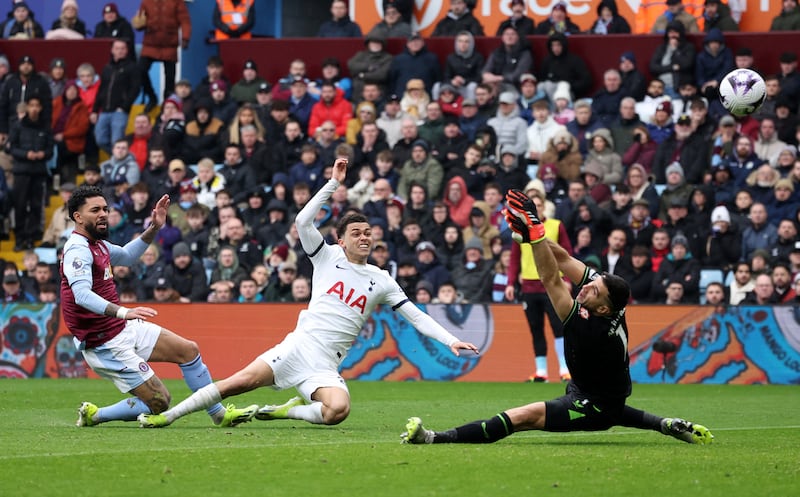 Tottenham Hotspur's Brennan Johnson scores their second goal past Aston Villa's Emiliano Martinez. Reuters