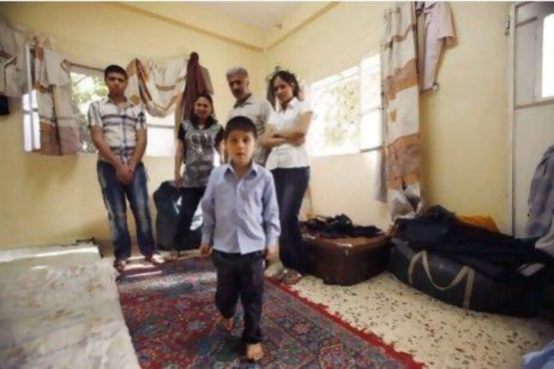 Jalal Aziz's family fled Baghdad after militants stormed his home beat him in front of his wife and shot his teenage son in the arm.