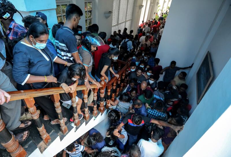 Crowds flock to take a look inside the presidential palace in Colombo. EPA