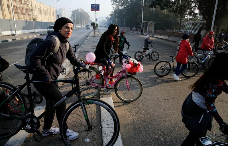 Female bicycle riders of "Wings Bike" team prepare to ride in downtown Cairo, Egypt. The event aimed to encourage female who face sexual harassment during riding to ride bicycles, the organisers said. AP