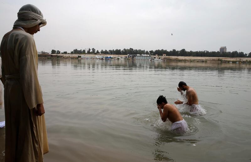 Mandaeans performing religious duties during the Benja festival in Baghdad, Iraq. Reuters