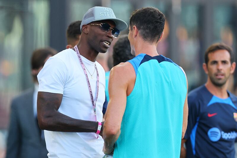 Former NFL player Chad Johnson greets Robert Lewandowski at DRV PNK Stadium in Fort Lauderdale, Florida.AFP