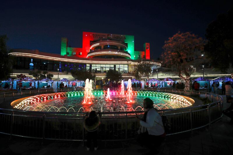 Palestinians visit the Christmas market in the West Bank city of Ramallah, marking the beginning of festive celebrations in the city