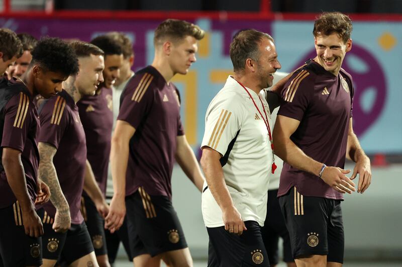 AL RUWAIS, QATAR - NOVEMBER 30: Hansi Flick, Head Coach of Germany, interacts with Leon Goretzka of Germany during the Germany Training Session at Al Shamal Stadium on November 30, 2022 in Al Ruwais, Qatar. (Photo by Alexander Hassenstein / Getty Images)
