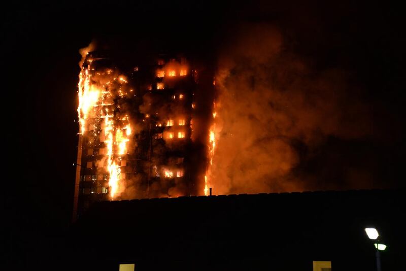 Flames engulf the 27-storey block of flats in west London. Giulio Thuburn / AFP