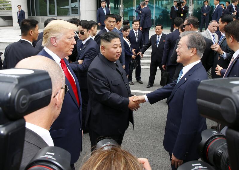 South Korean President Moon Jae-in meets with North Korean leader Kim Jong-un, alongside US President Donald Trump. AFP