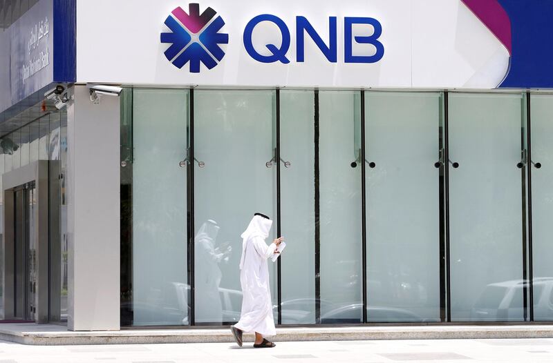 A man walks past a branch of Qatar National Bank (QNB) in Riyadh on June 5, 2017. Faisal Al Nasser / Reuters
