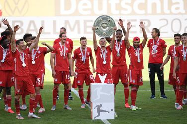 Mickael Cuisance (C) of Bayern Munich lifts the trophy to celebrate the German soccer championship title following the Bundesliga match between VfL Wolfsburg and Bayern Munich in Wolfsburg, Germany, 27 June 2020. EPA/STUART FRANKLIN / POOL CONDITIONS - ATTENTION: The DFL regulations prohibit any use of photographs as image sequences and/or quasi-video.