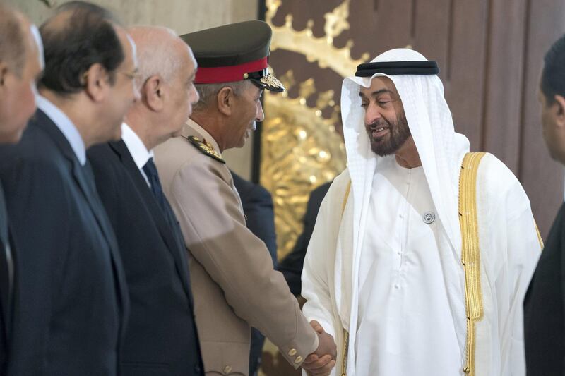 CAIRO, EGYPT - August 07, 2018: HH Sheikh Mohamed bin Zayed Al Nahyan Crown Prince of Abu Dhabi Deputy Supreme Commander of the UAE Armed Forces (R), greets a guest, at the Heliopolis Palace. 
( Mohamed Al Hammadi / Crown Prince Court - Abu Dhabi )
---