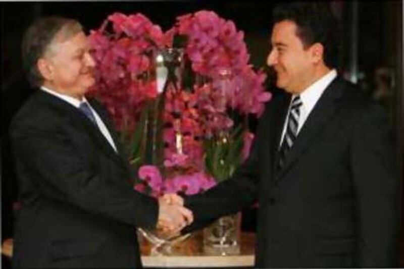 Ali Babacan, right, the Turkish foreign minister, greets his Armenian counterpart Eduard Nalbandian before their meeting in Istanbul.