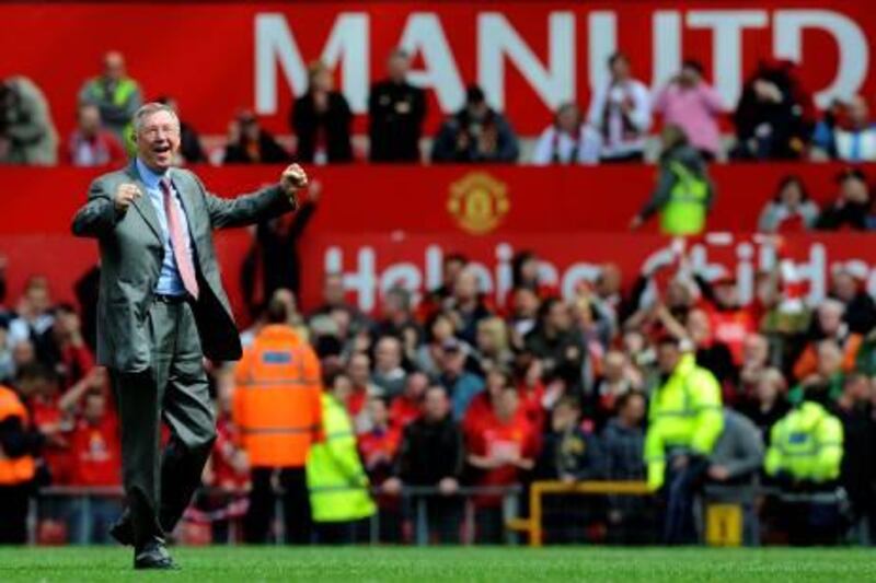 (FILES) Photo taken on May 16, 2009 of Manchester United's Scottish manager Sir Alex Ferguson celebrating on the pitch after his team drew 0-0 with Arsenal to clinch the Premier League Championship at Old Trafford, Manchester. Sir Alex Ferguson celebrates 25 years in charge of Manchester United on November 6, 2011, undaunted by the possibility that the greatest challenges of an extraordinary career may yet lie ahead of him.
 AFP PHOTO/ADRIAN DENNIS.  FOR EDITORIAL USE ONLY Additional licence required for any commercial/promotional use or use on TV or internet (except identical online version of newspaper) of Premier League/Football League photos. Tel DataCo +44 207 2981656. Do not alter/modify photo.
 *** Local Caption ***  206181-01-08.jpg