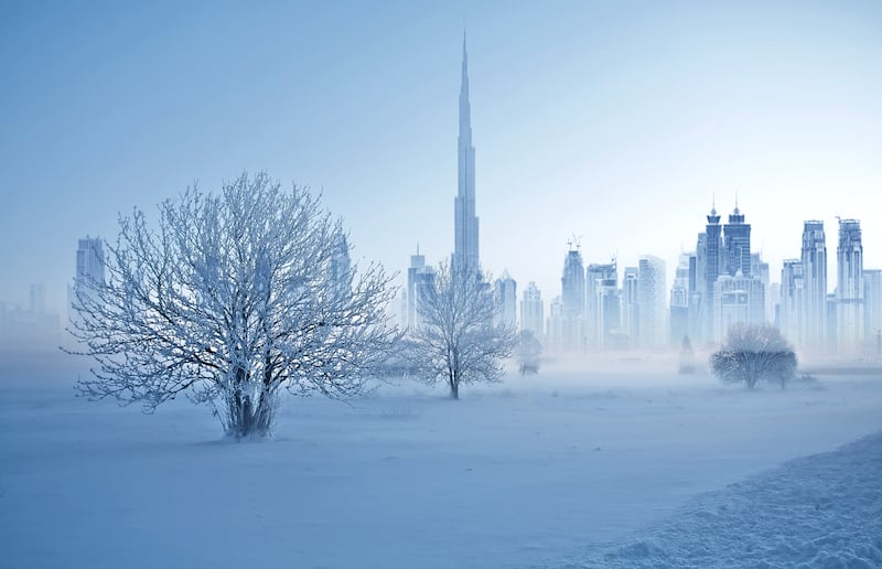 A snowy scene with Burj Khalifa and Downtown Dubai in the background.