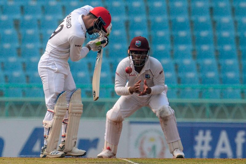Afghanistan's Rashid Khan, left, during the one-off Test against the West Indies in Lucknow, India. AFP