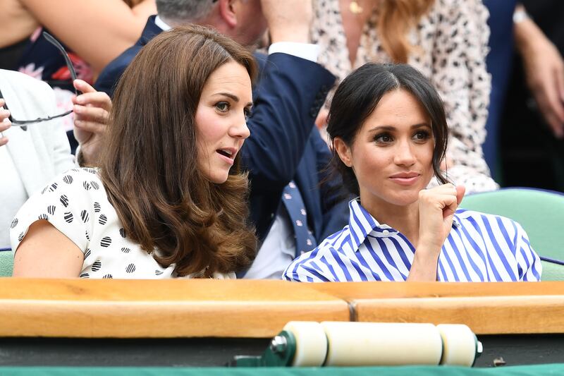 Catherine and Meghan attend the Wimbledon Lawn Tennis Championships in London in July 2018. Getty Images