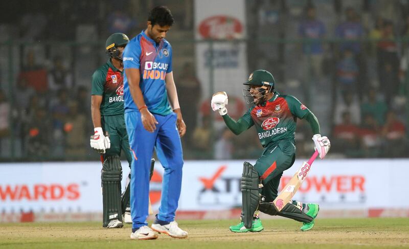 Bangladesh's Mushfiqur Rahim, right, celebrates after wining first T20 cricket match against India at the Arun Jaitley stadium, in New Delhi, India, Sunday, Nov. 3, 2019. (AP Photo/Manish Swarup)