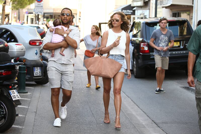 John Legend, Teigen and their baby, Luna Simone, in Saint-Tropez, France, on July 25, 2016. Reuters