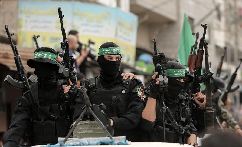 Members of the Islamist movement Hamas' military wing Al-Qassam Brigades ride in vehicles during the funeral of six of their comrades who were killed in an unexplained explosion the night before, in Deir al-Balah in the central Gaza strip on May 6, 2018.
Gaza's health ministry confirmed six people were killed and three others wounded in what residents said appeared to be an accidental explosion in the Az-Zawayda area of the central Gaza Strip.
Al-Qassam Brigades blamed Israel for the explosion without providing details or proof, saying incident occurred during a "complex security and intelligence operation" and calling it a "serious and large security incident".
 / AFP PHOTO / MAHMUD HAMS