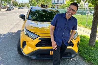 New York City cab driver Sukhcharn Singh poses for a photo with his taxi in the Queens borough of New York. AP 