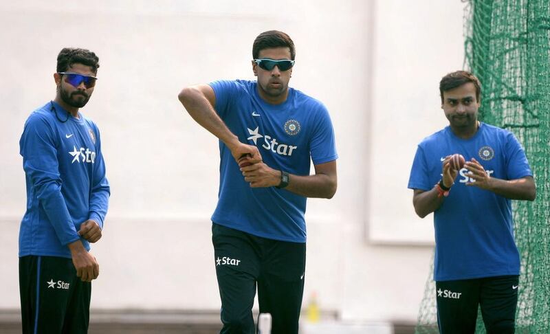 Ravichandran Ashwin, centre, has been backed by India captain MS Dhoni following a sub-par series against Australia. Prakash Singh / AFP