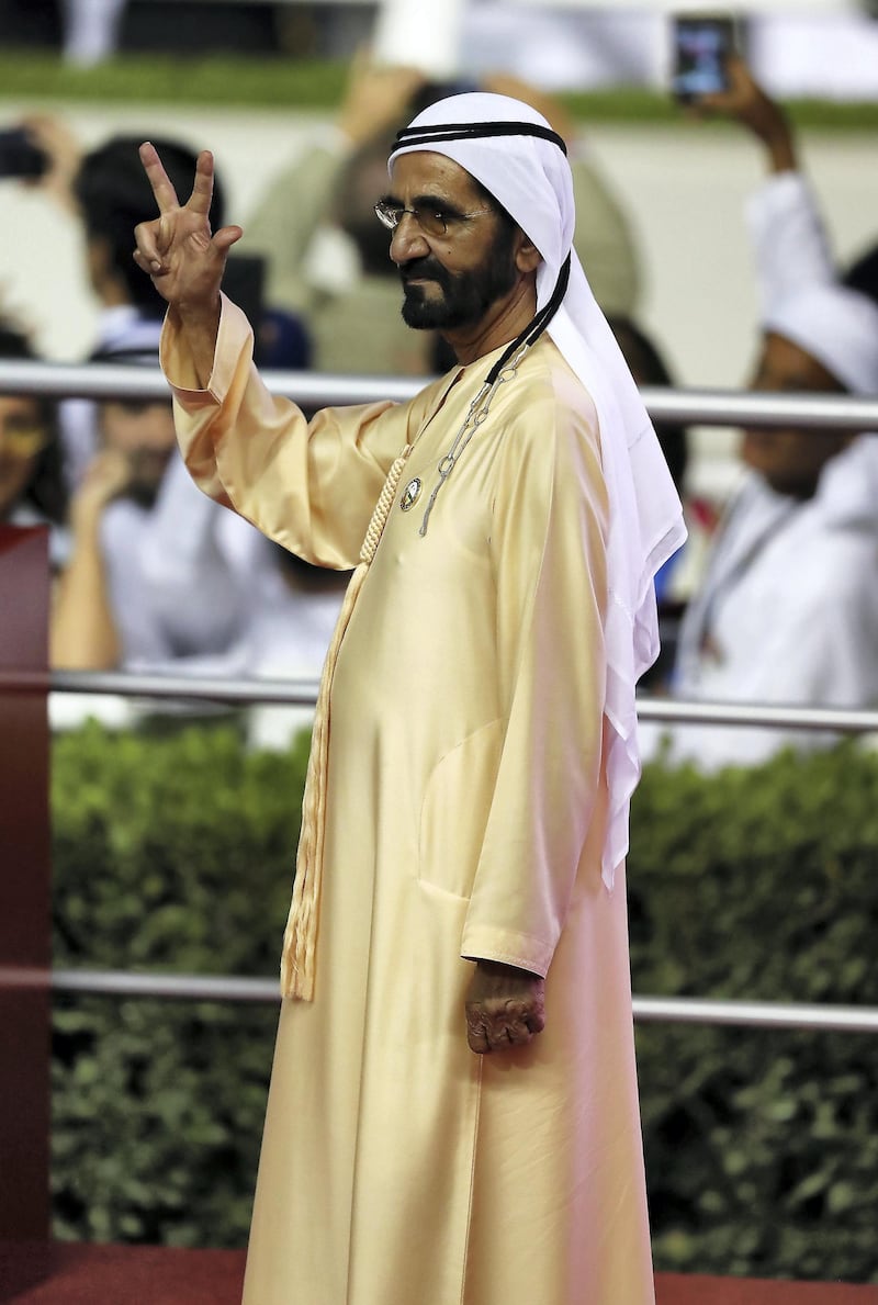 DUBAI , UNITED ARAB EMIRATES , MARCH 30  – 2018 :- 
Sheikh Mohammed bin Rashid Al Maktoum , Vice President and Prime Minister of the United Arab Emirates, and Ruler of the Emirate of Dubai showing the victory sign after Thunder Snow ( IRE  ) ridden by Christophe Soumillon ( no  12 ) won the 9th horse race Dubai World Cup 2000m dirt during the Dubai World Cup held at Meydan Racecourse in Dubai. ( Pawan Singh / The National ) For News/Sports/Instagram/Big Picture. Story by Amith/Rupert
