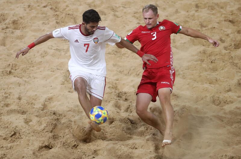 ASUNCION, PARAGUAY - NOVEMBER 22: Hesham Muntaser of United Arab Emirates UAE is challenged by Illia Savich of Belarus during the FIFA Beach Soccer World Cup Paraguay 2019 group C match between Belarus and United Arab Emirates at Estadio Mundialista "Los Pynandi" on November 22, 2019 in Asuncion, Paraguay. (Photo by Alex Grimm - FIFA/FIFA via Getty Images) (Photo by Alex Grimm - FIFA/FIFA via Getty Images)