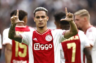 Ajax's Brazilian midfielder Antony Matheus Dos Santos celebrates after socring the 2-1 goal during the Dutch Eredivisie match between Ajax Amsterdam and FC Groningen at the Johan Cruijff ArenA in Amsterdam, on August 14, 2022.  (Photo by MAURICE VAN STEEN  /  ANP  /  AFP)  /  Netherlands OUT