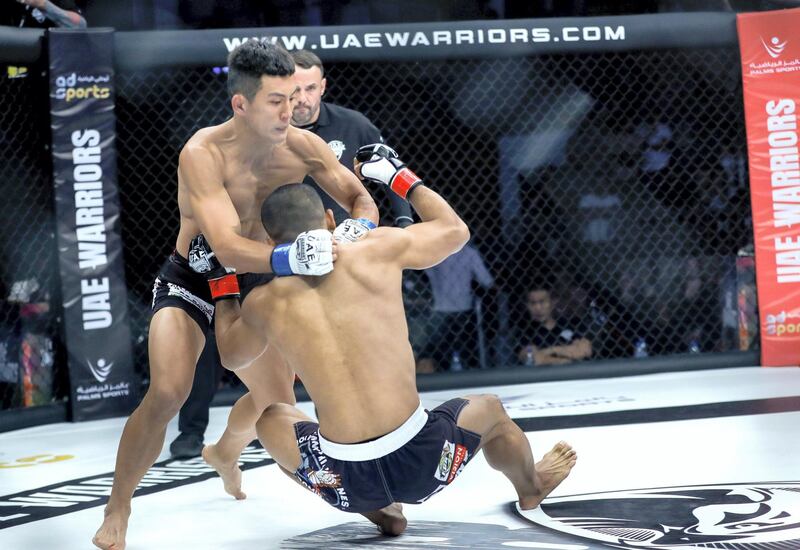 Abu Dhabi, United Arab Emirates, October 18, 2019.  UAE Warriors Fighting Championship at the Mubadala Arena.  The new featherweight champion, Koran Lee Do-gyeom from South Korea knocks out Rolando Dy of the Philippines on the first round.
Victor Besa/The National
Section:  SP
Reporter:  Amith Passela