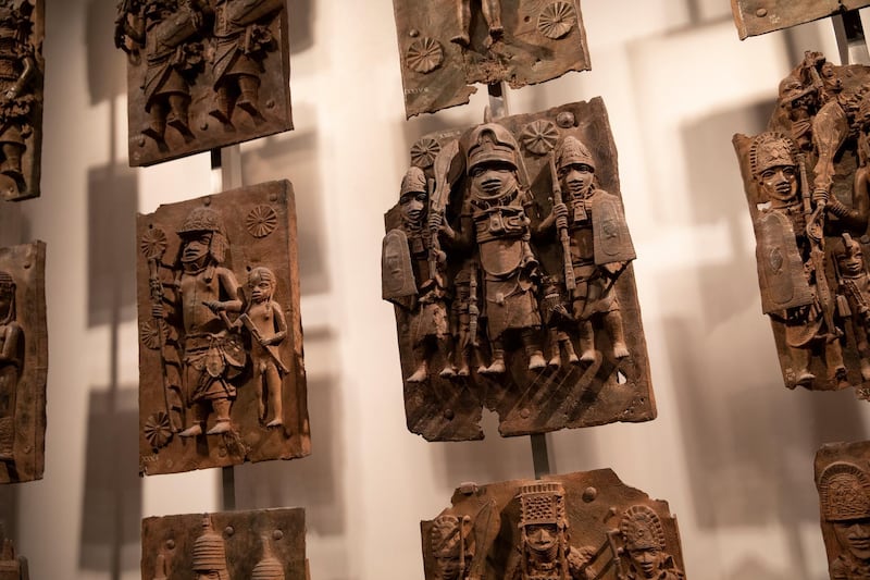LONDON, ENGLAND - NOVEMBER 22: Plaques that form part of the Benin Bronzes are displayed at The British Museum on November 22, 2018 in London, England. The British Museum has agreed to loan the plaques back to a new museum in Benin City in Nigeria. The Benin Bronzes were taken from Africa by British troops in 1897. The return of a basalt Easter Island Head figure has also been requested this week by The Governor of the Easter Islands, Tarita AlarcÃ³n Rapu amid a broader call for artefacts taken during colonial rule to be restituted. (Photo by Dan Kitwood/Getty Images)
