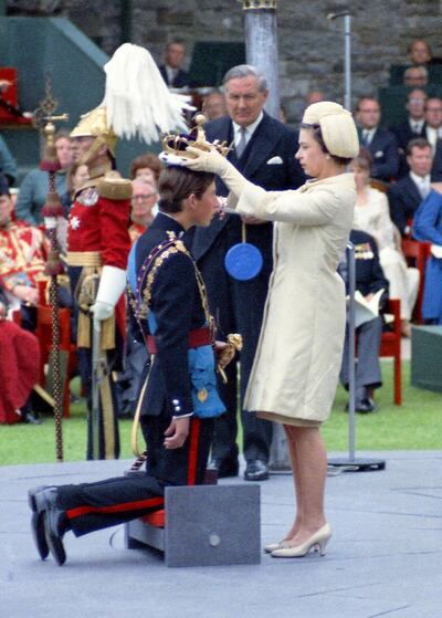 Queen Elizabeth II crowning her son Charles, Prince of Wales during his investiture ceremony at Caernafon Castle in Wales in 1969. AP