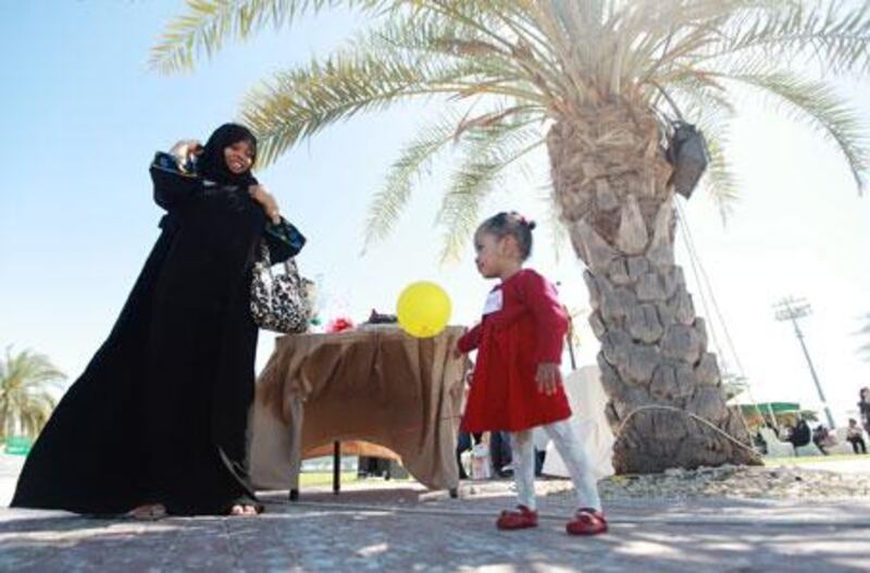 Wadema Abdullah, 2, and her mother, Latifa, attend the fifth annual reunion of babies born at the Corniche Hospital's Neonatal Intensive Care Unit.