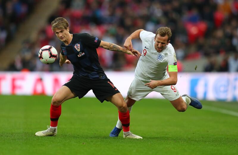 LONDON, ENGLAND - NOVEMBER 18: Harry Kane of England is challenged by Tin Jedvaj of Croatia  during the UEFA Nations League A group four match between England and Croatia at Wembley Stadium on November 18, 2018 in London, England. (Photo by Catherine Ivill/Getty Images) 